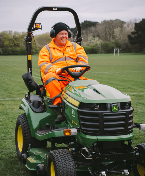 man on a ride-on grass cutter
